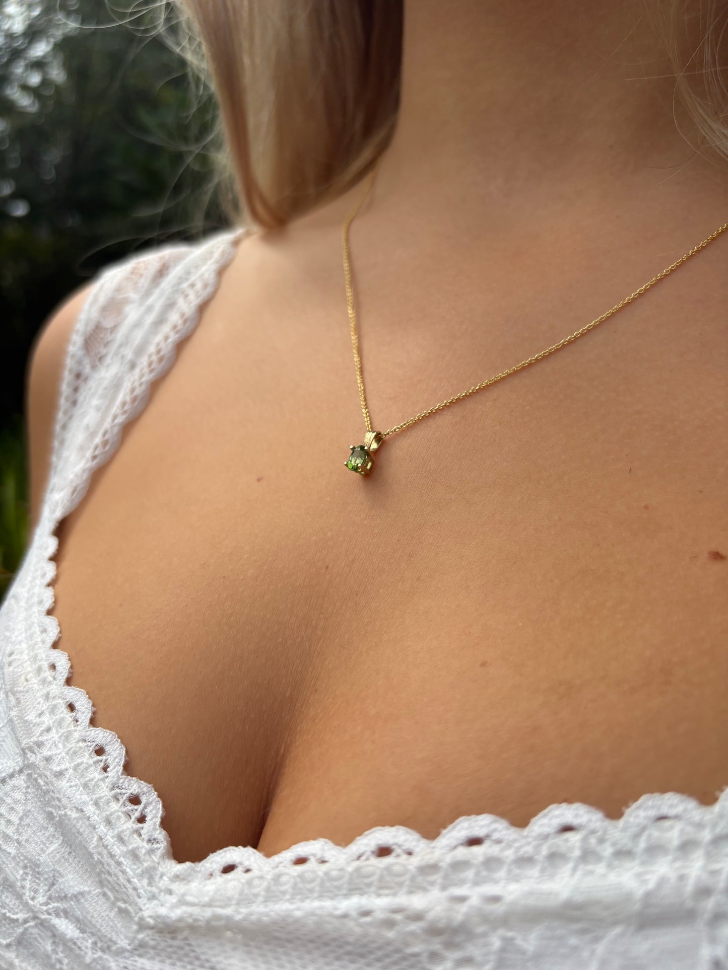 Gold pendant with tourmarlin