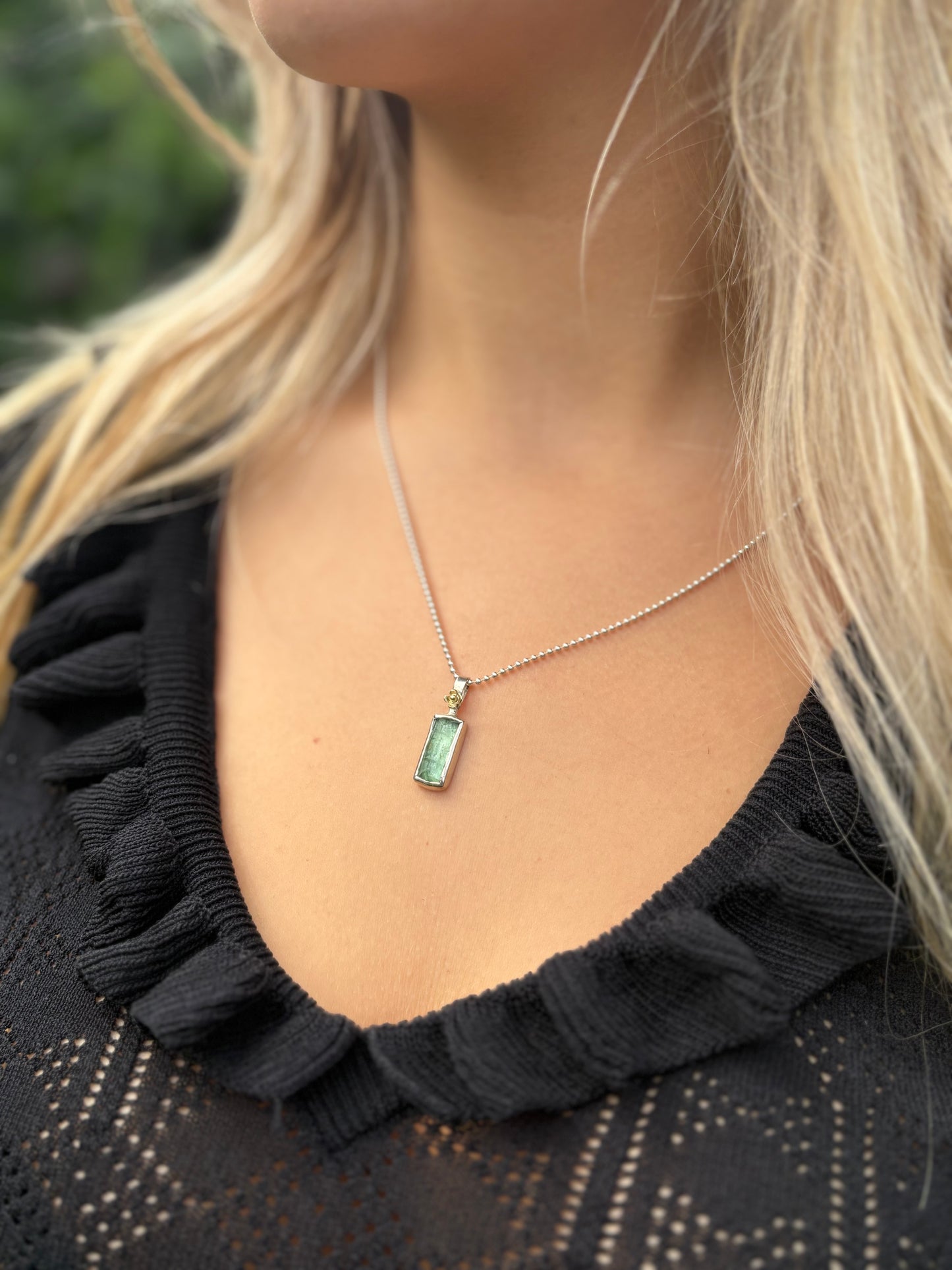 Silver pendant with green tourmaline and golden flower