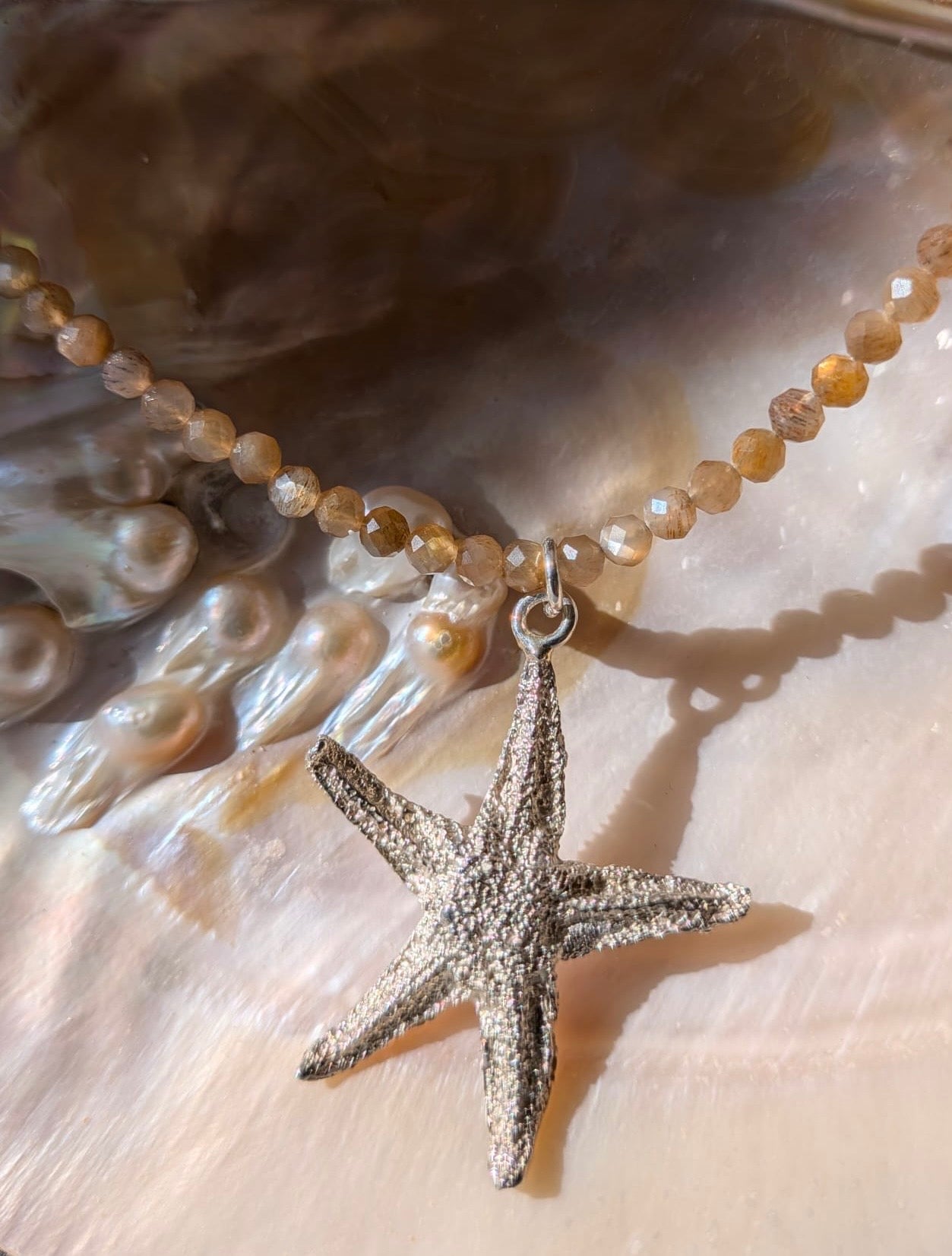 Zonnestenen collier met grote zilveren zeester