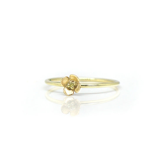 Fijne gouden ring met bloem en gele diamant