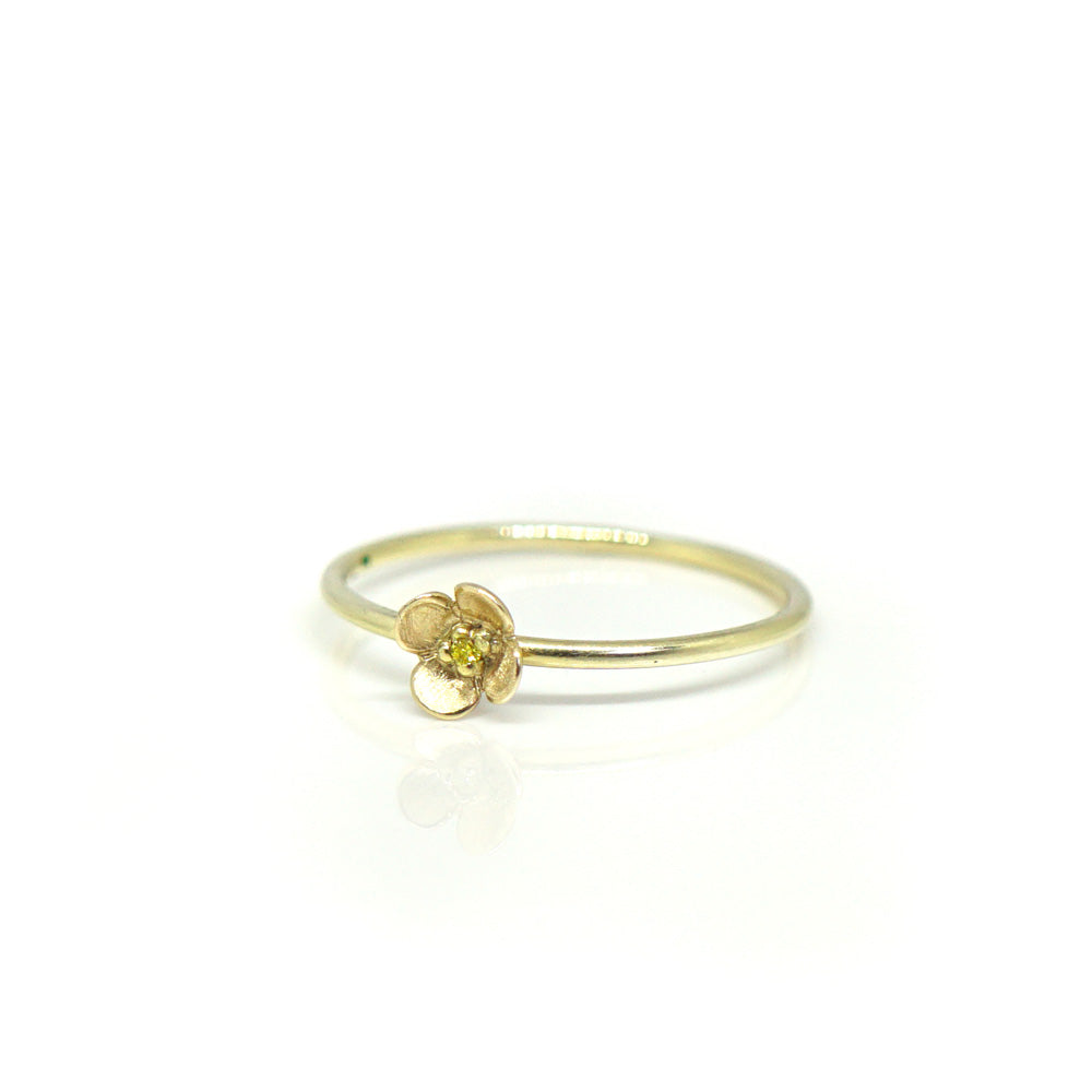 Fijne gouden ring met bloem en gele diamant