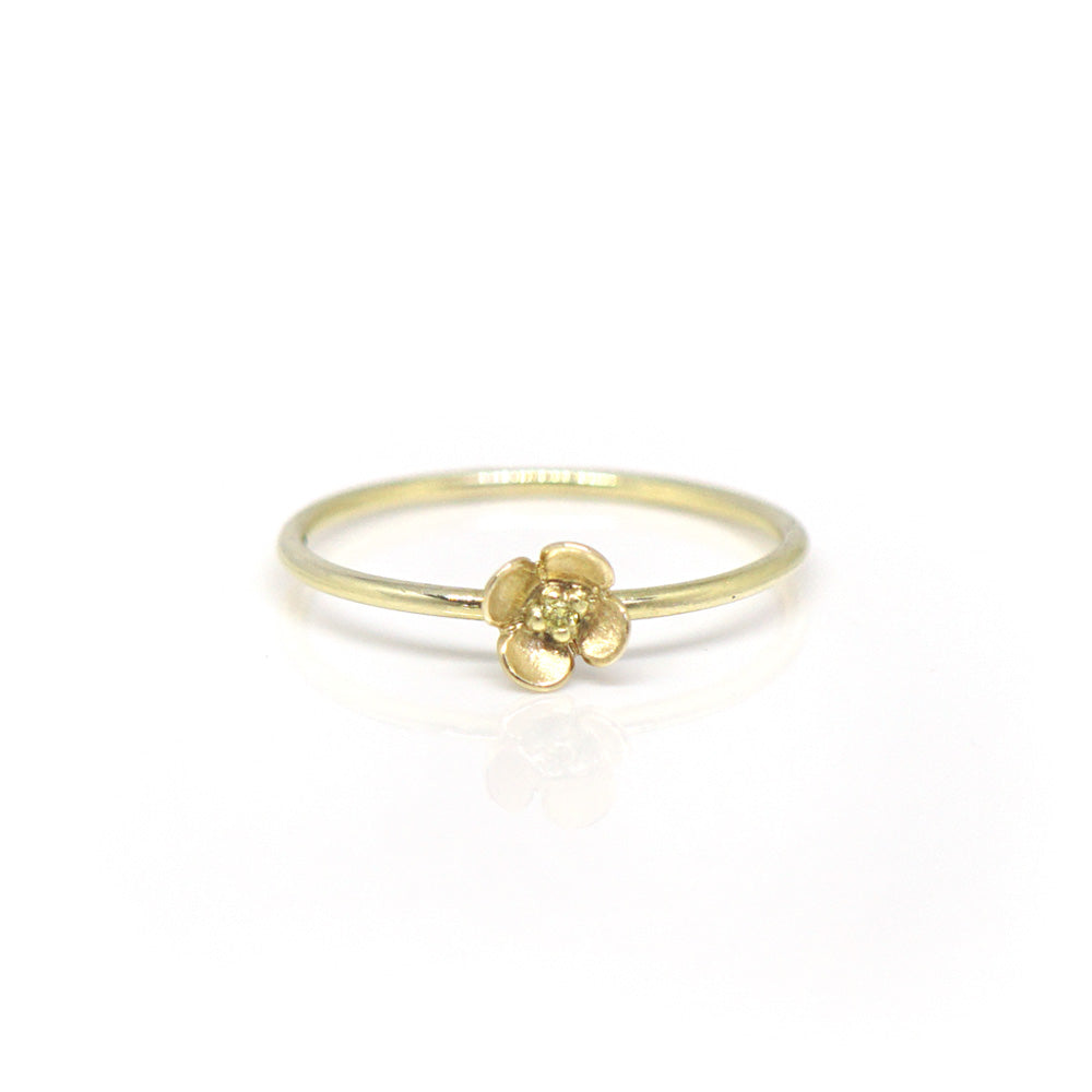 Fijne gouden ring met bloem en gele diamant