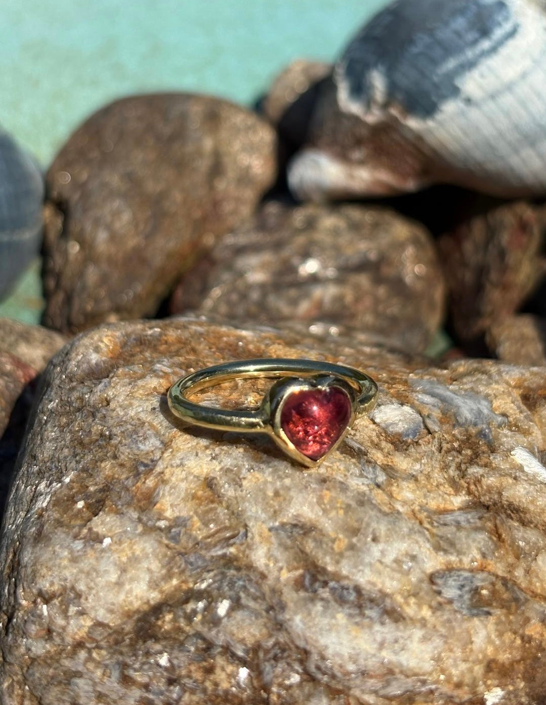 Gold ring with heart-shaped tourmaline stone