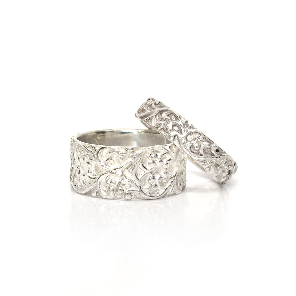 Slim silver ring with a floral relief