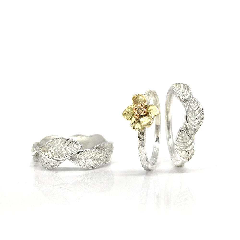 Silver ring with golden flower