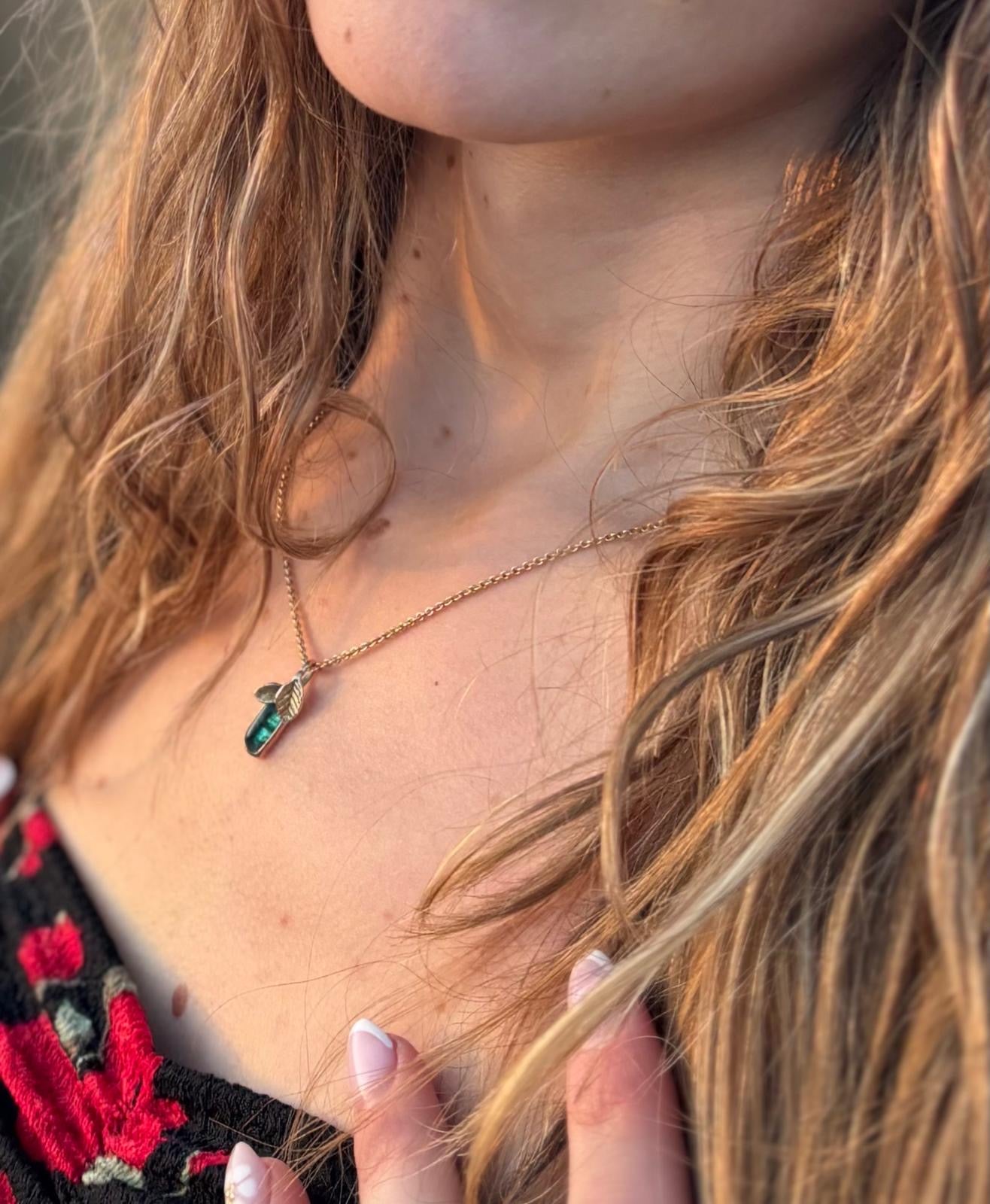 Gold necklace with green tourmaline