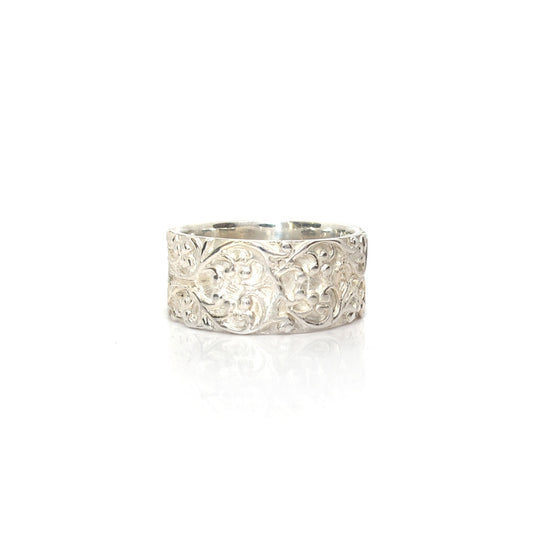 Wide silver ring with floral relief