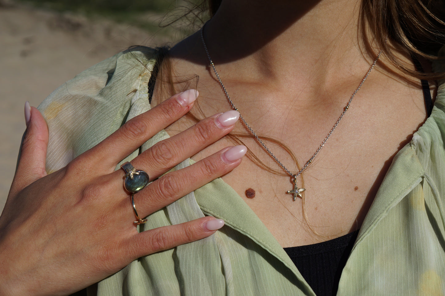 Silver necklace with gold balls and gold starfish with diamond