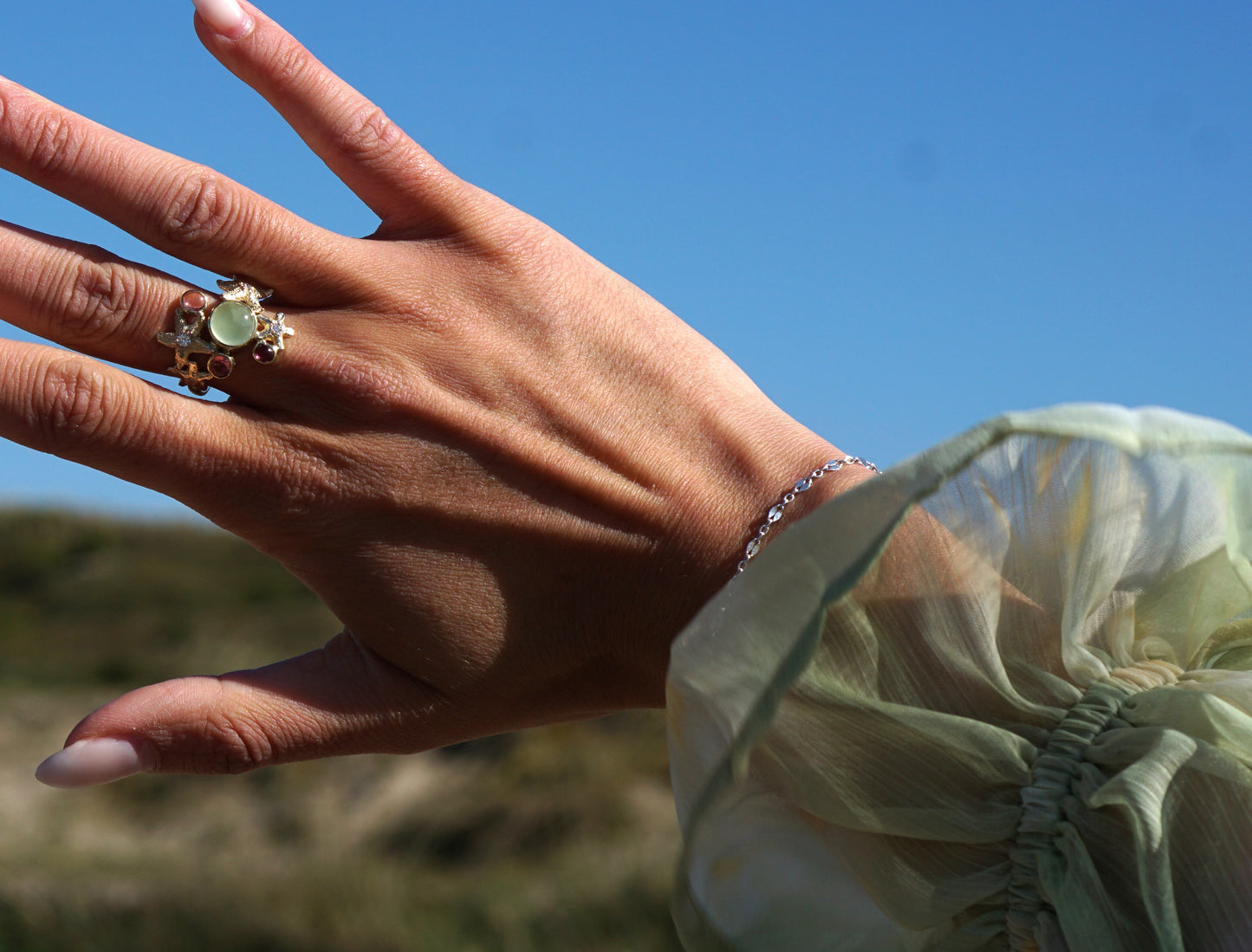 Stunning gold starfish ring with diamond and pink and green tourmaline