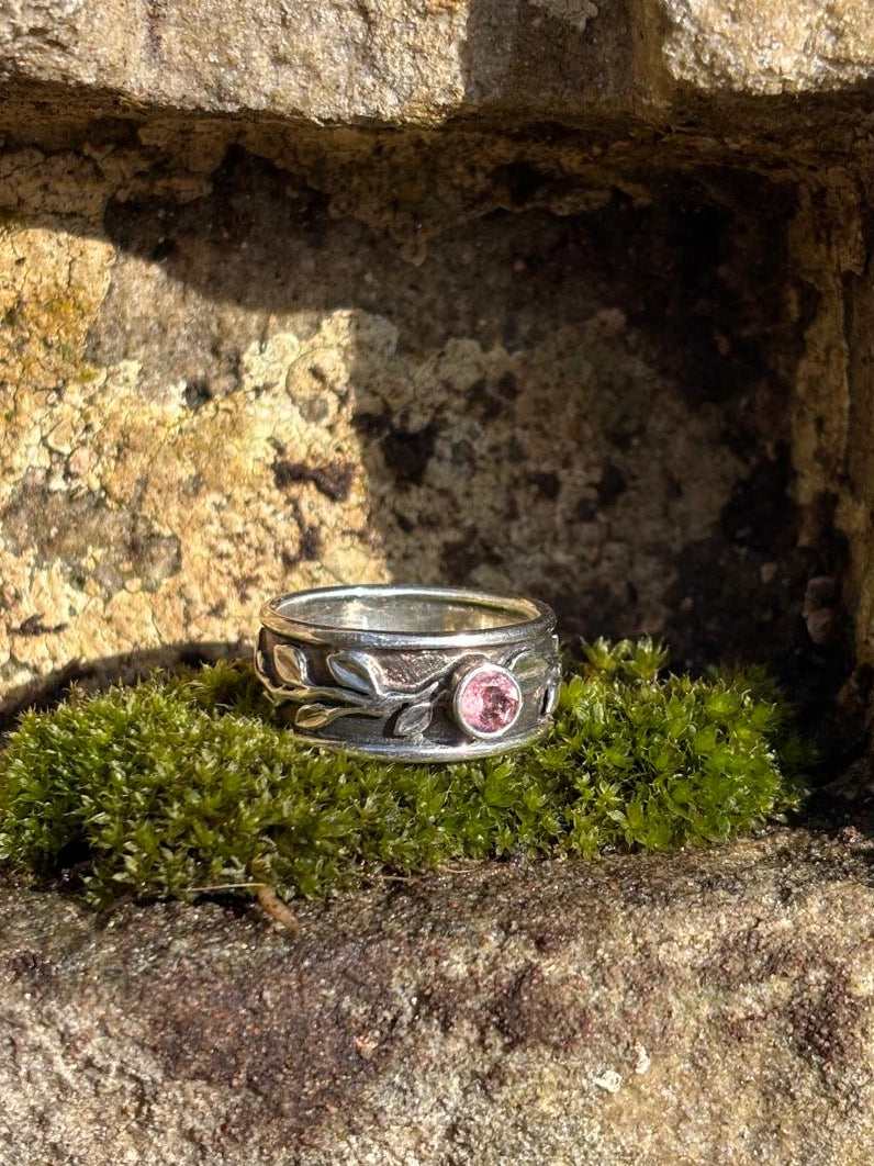 Wide silver ring with leaves and pink tourmaline