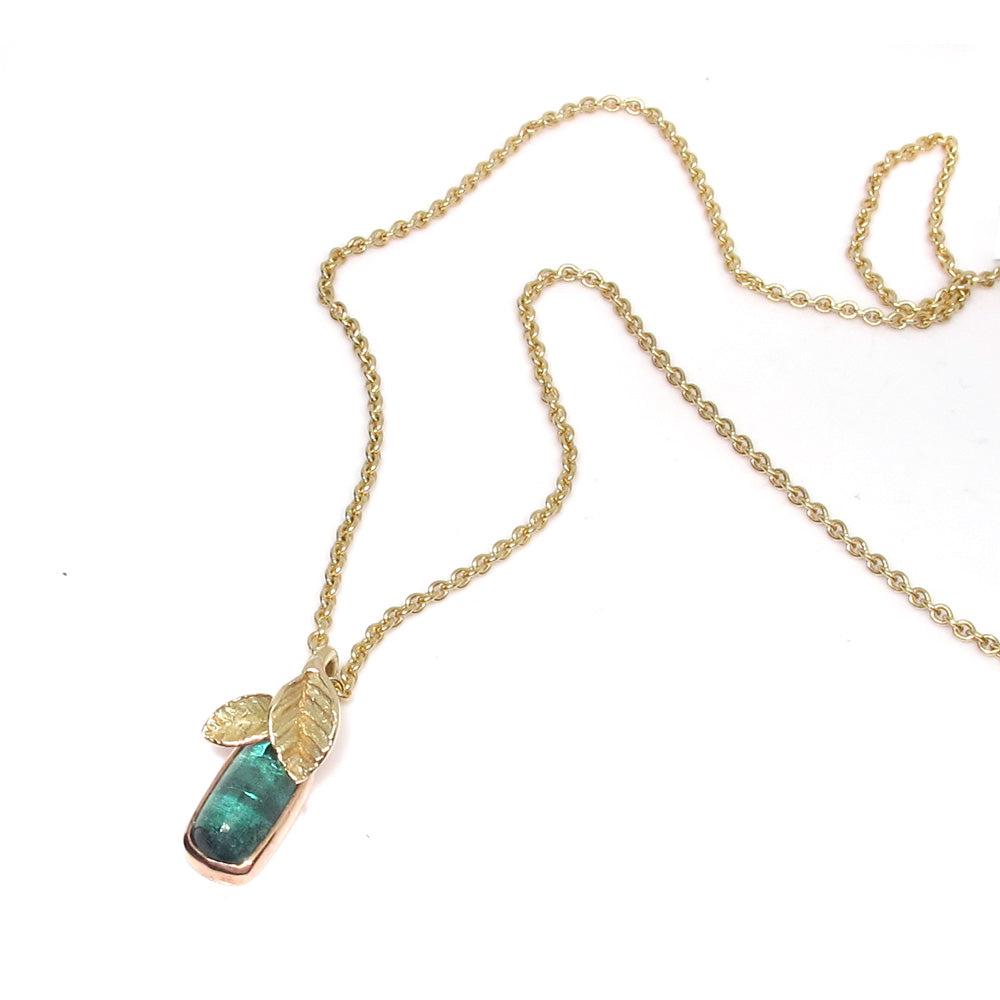 Gold necklace with green tourmaline