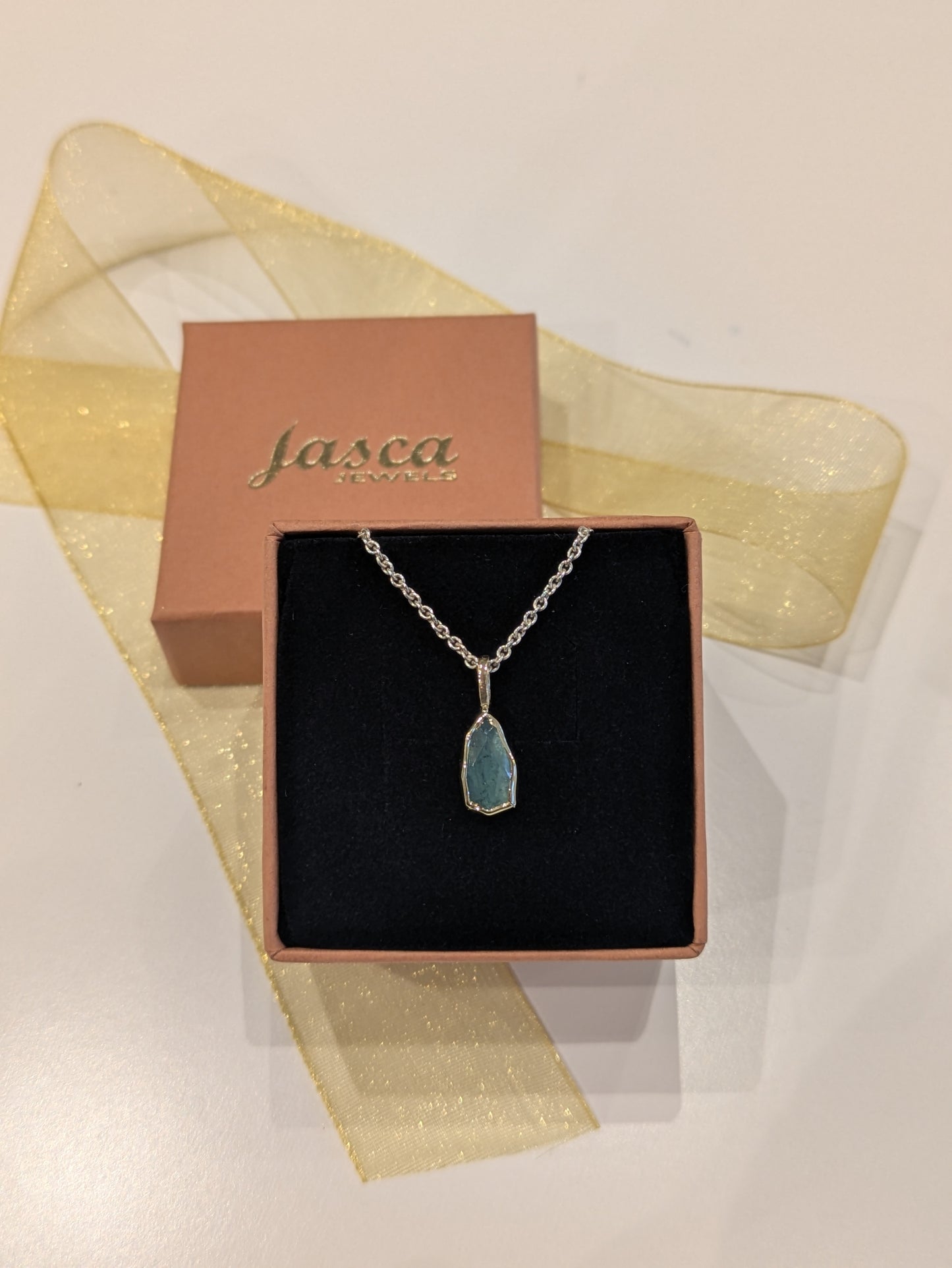 Pendant with tourmaline in gold setting