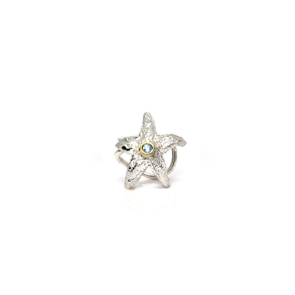 Silver ear clip with gold and aquamarine